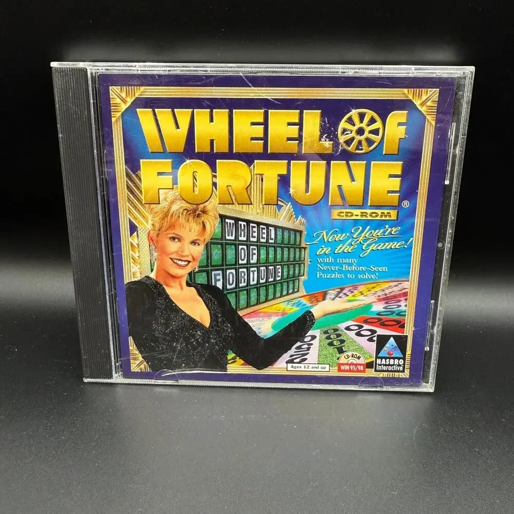 PC Mixed Game Lot of 4 Solitaire Wheel of Fortune Prime Suspects Trophy Bass